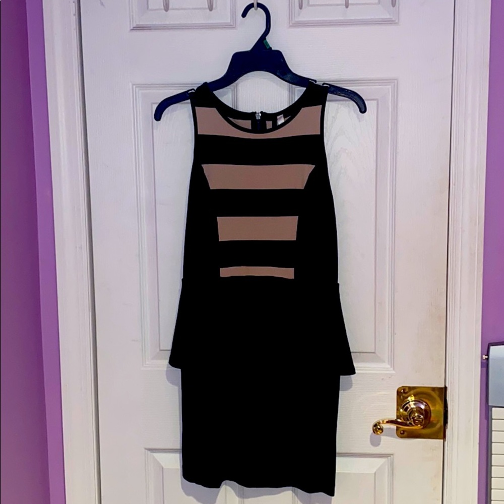 black dress with peplum and white/beige stripes